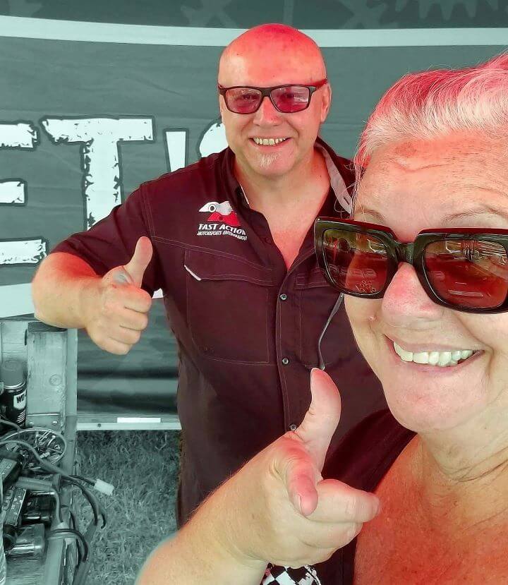 Micro reality race track business owners smiling and giving the thumbs up